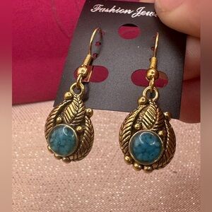 Gold/brass colored fashion dangle earrings W/ a teal blue pop of enamel color